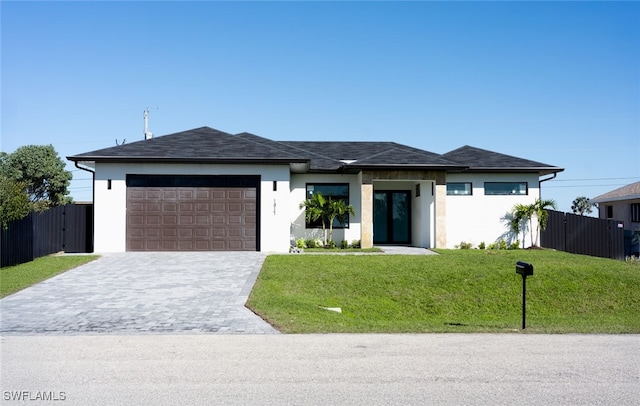 1817 NE 17th St, Cape Coral, FL 33909 - view of front of house featuring a front yard, an attached garage, fence, stucco siding, and decorative driveway