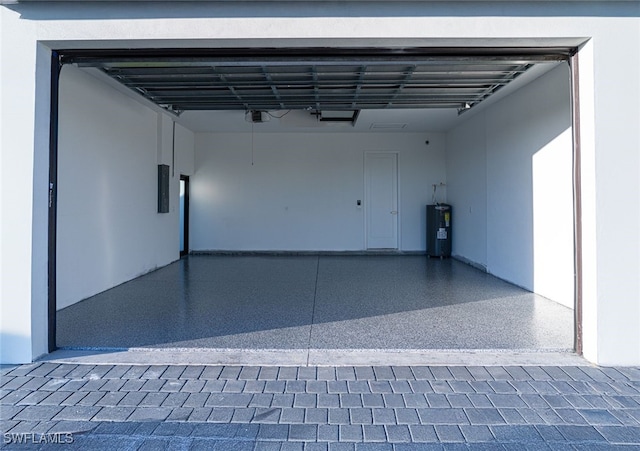 1817 NE 17th St, Cape Coral, FL 33909 - garage featuring electric panel, water heater, and a garage door opener