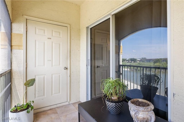 11520 Villa Grand Unit 1018, Fort Myers, FL 33913 - property entrance with stucco siding and a balcony