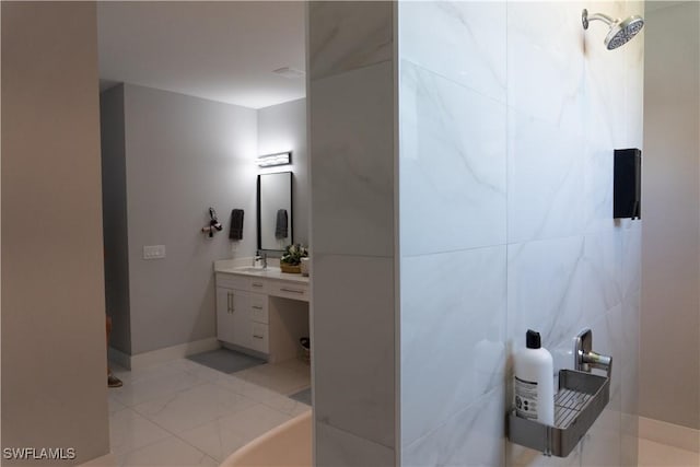 bathroom featuring baseboards and vanity