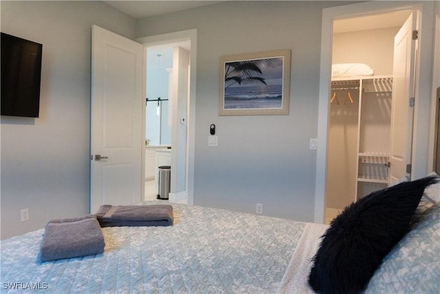 bedroom featuring a closet and a walk in closet