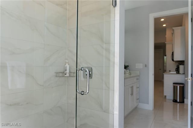 bathroom with a shower stall, baseboards, recessed lighting, and vanity