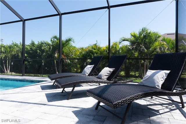 view of patio featuring a lanai and an outdoor pool