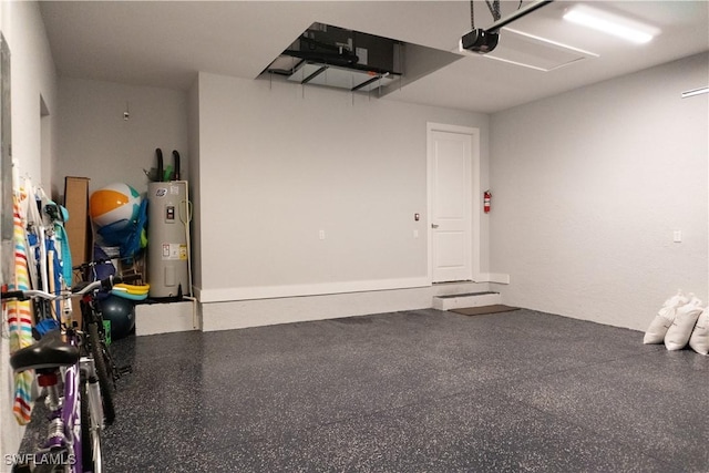 garage featuring water heater and a garage door opener