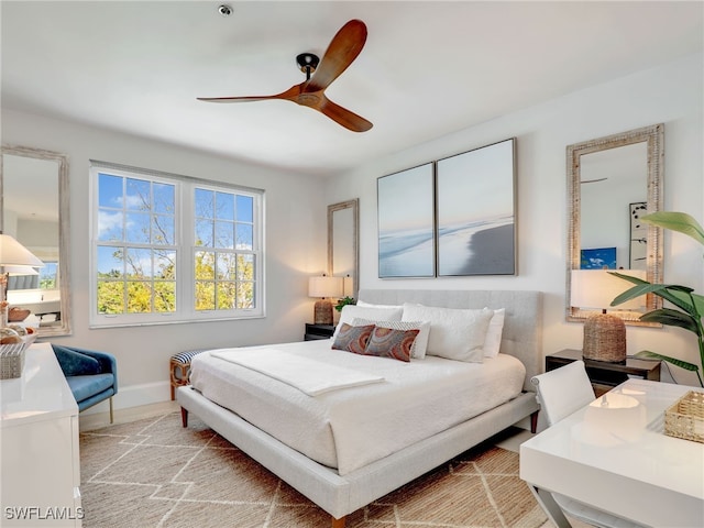 365 5th Ave S Unit 307, Naples, FL 34102 - bedroom with baseboards and ceiling fan