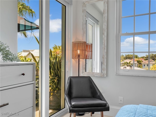 365 5th Ave S Unit 307, Naples, FL 34102 - living area with baseboards and plenty of natural light