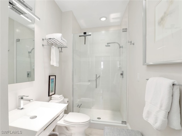365 5th Ave S Unit 307, Naples, FL 34102 - full bathroom featuring a stall shower, toilet, and vanity