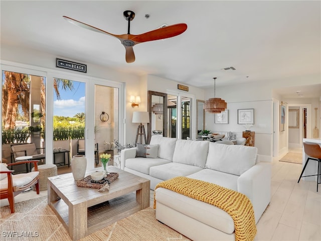 365 5th Ave S Unit 307, Naples, FL 34102 - living room featuring a ceiling fan