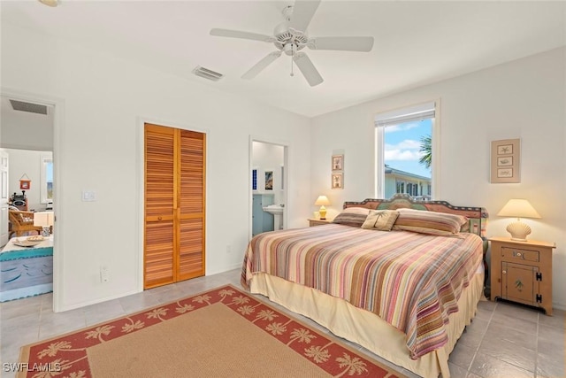 984 Black Skimmer Way, Sanibel, FL 33957 - bedroom featuring a closet, visible vents, ceiling fan, connected bathroom, and tile patterned floors