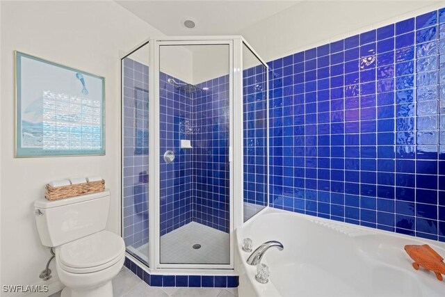 984 Black Skimmer Way, Sanibel, FL 33957 - bathroom featuring toilet, a garden tub, tile patterned floors, and a shower stall