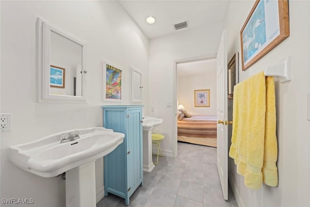 984 Black Skimmer Way, Sanibel, FL 33957 - bathroom featuring baseboards, visible vents, tile patterned flooring, and ensuite bathroom