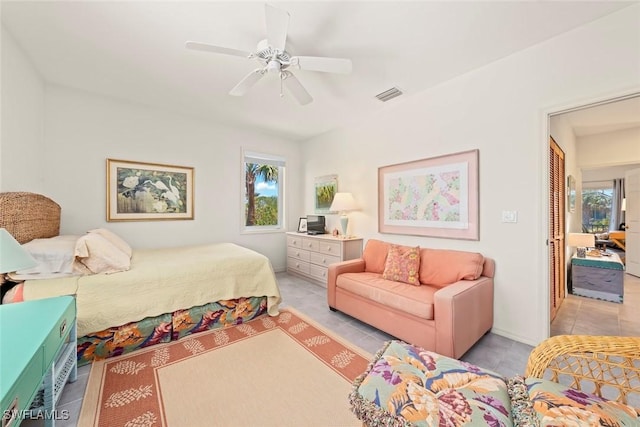 984 Black Skimmer Way, Sanibel, FL 33957 - bedroom with tile patterned flooring, multiple windows, ceiling fan, and visible vents