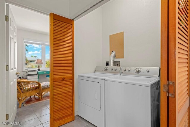 984 Black Skimmer Way, Sanibel, FL 33957 - laundry room featuring separate washer and dryer, laundry area, and light tile patterned floors