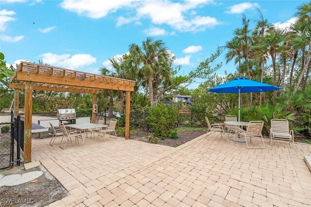 984 Black Skimmer Way, Sanibel, FL 33957 - view of patio / terrace featuring a pergola, outdoor dining area, a grill, and fence