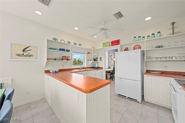 984 Black Skimmer Way, Sanibel, FL 33957 - kitchen featuring visible vents, open shelves, a ceiling fan, and white appliances