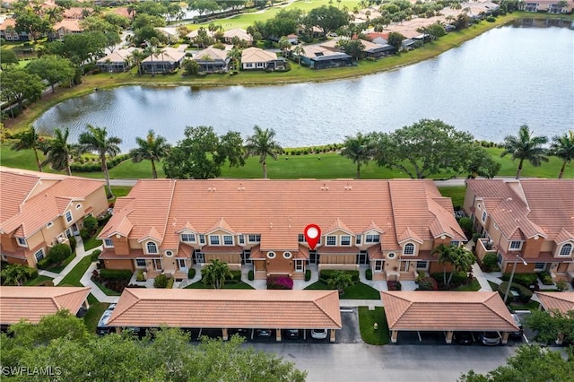 aerial perspective of suburban area with a large body of water