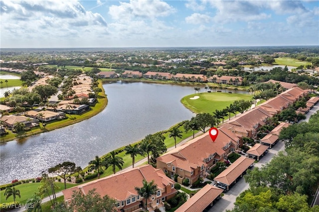 aerial view of residential area with a nearby body of water and a local golf course