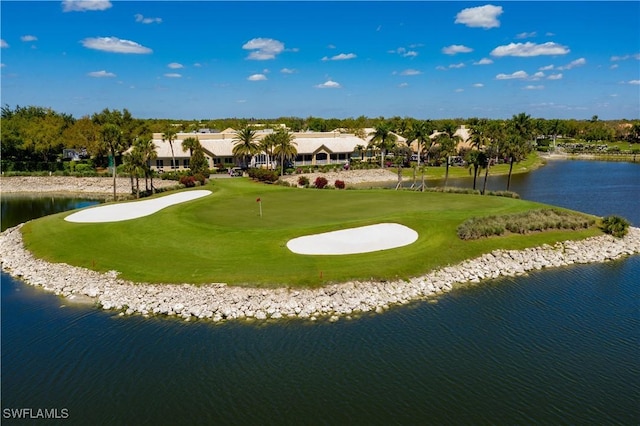 view of property's community featuring golf course view and a water view
