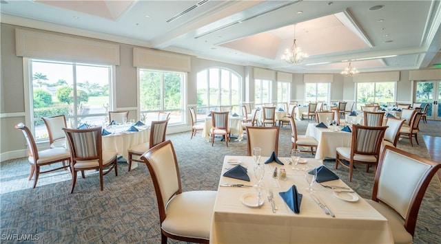 dining area with carpet, a chandelier, and plenty of natural light