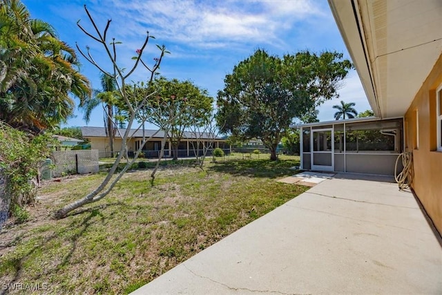 2590 Poinciana St, Naples, FL 34105 - view of yard featuring a sunroom and fence