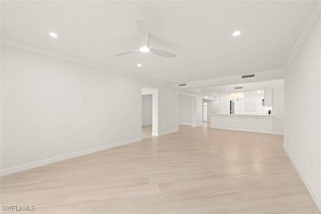 unfurnished living room with ornamental molding, light wood-style flooring, a ceiling fan, recessed lighting, and baseboards