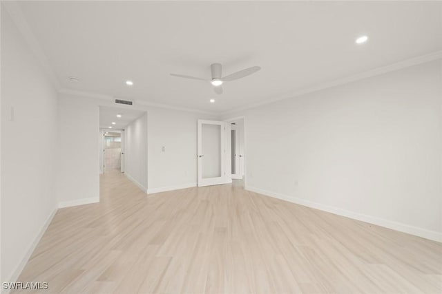 empty room featuring light wood-type flooring, ornamental molding, recessed lighting, ceiling fan, and baseboards