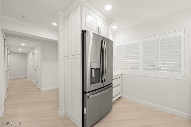 kitchen featuring stainless steel fridge, baseboards, white cabinetry, recessed lighting, and light wood-type flooring
