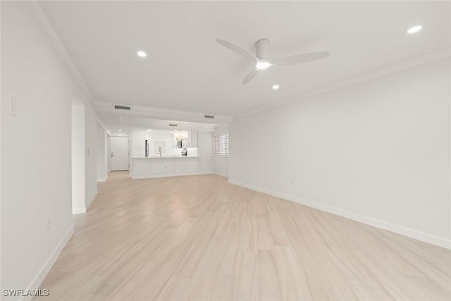 unfurnished living room featuring ornamental molding, ceiling fan, recessed lighting, light wood-style flooring, and baseboards
