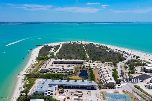drone / aerial view of waterfront with a beach