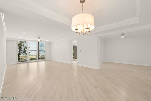 unfurnished living room featuring ornamental molding, light wood finished floors, baseboards, a chandelier, and recessed lighting