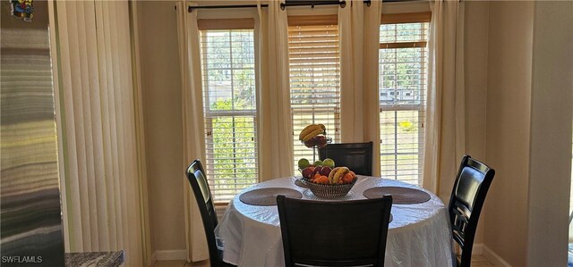 8051 Primrose Blvd, Labelle, FL 33935 - dining space featuring baseboards and plenty of natural light