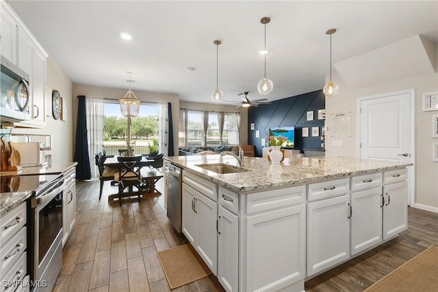 12605 Laurel Cove Dr, Fort Myers, FL 33913 - kitchen featuring a sink, a ceiling fan, dark wood-style flooring, and stainless steel appliances