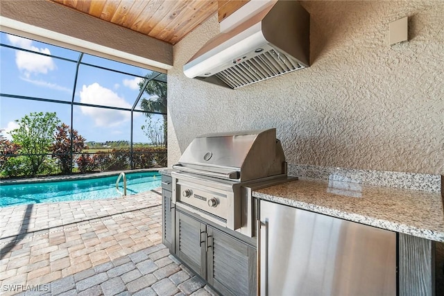 view of patio / terrace with a lanai, area for grilling, and an outdoor pool
