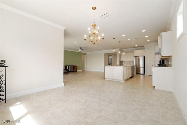 kitchen featuring visible vents, ornamental molding, open floor plan, backsplash, and freestanding refrigerator