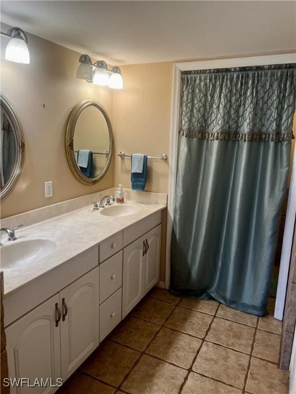 5765 Trailwinds Dr Unit 115, Fort Myers, FL 33907 - bathroom with tile patterned floors and double vanity