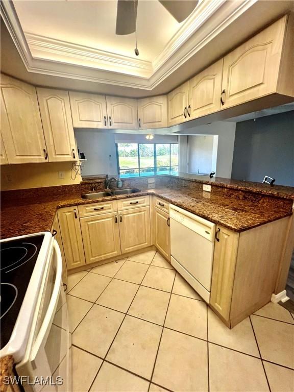 5765 Trailwinds Dr Unit 115, Fort Myers, FL 33907 - kitchen with dishwasher, range, a tray ceiling, ornamental molding, and a sink