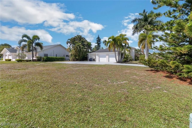 7904 Eagles Flight Ln, Fort Myers, FL 33912 - view of front of property featuring a front yard, a garage, and concrete driveway