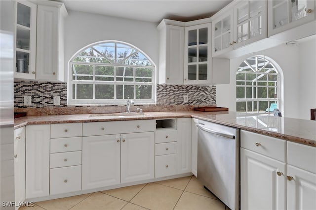 7904 Eagles Flight Ln, Fort Myers, FL 33912 - kitchen with a sink, white cabinetry, tasteful backsplash, and dishwasher