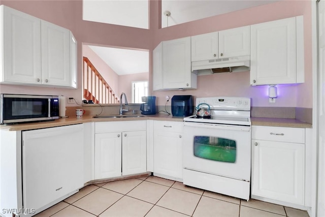 321 NW 19th Ter, Cape Coral, FL 33993 - kitchen with white appliances, under cabinet range hood, a sink, and light countertops