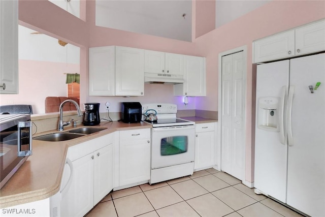 321 NW 19th Ter, Cape Coral, FL 33993 - kitchen with white appliances, under cabinet range hood, a sink, white cabinetry, and light tile patterned flooring