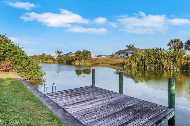 321 NW 19th Ter, Cape Coral, FL 33993 - dock area featuring a water view and a lawn