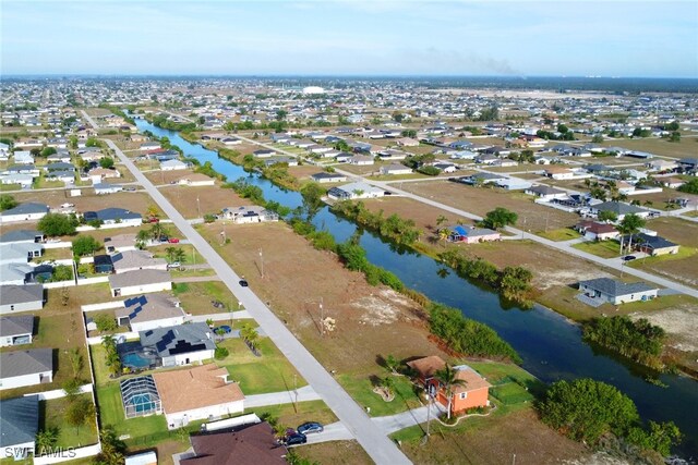 321 NW 19th Ter, Cape Coral, FL 33993 - aerial overview of property's location with a nearby body of water and nearby suburban area
