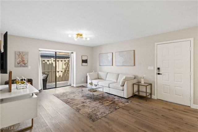 living room featuring baseboards and wood finished floors
