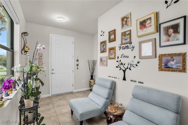 4558 Lamaida Ln, Ave Maria, FL 34142 - living area featuring light tile patterned floors and baseboards