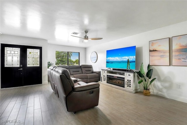 387 S Heathwood Dr, Marco Island, FL 34145 - living area featuring a ceiling fan, baseboards, visible vents, and wood finished floors