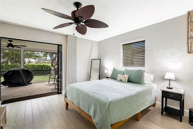 387 S Heathwood Dr, Marco Island, FL 34145 - bedroom featuring baseboards, ceiling fan, access to outside, wood finished floors, and a textured wall