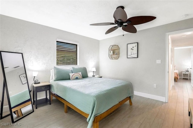 387 S Heathwood Dr, Marco Island, FL 34145 - bedroom featuring light wood-style floors, baseboards, and ceiling fan