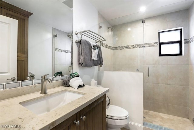 387 S Heathwood Dr, Marco Island, FL 34145 - full bath with a stall shower, vanity, and toilet