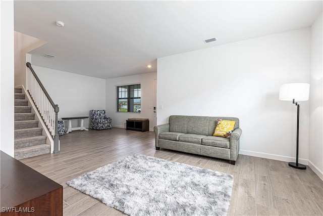 18707 Ivywood Pl, Estero, FL 33928 - living room with visible vents, baseboards, stairway, and wood finished floors
