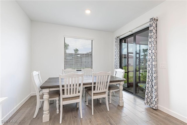 18707 Ivywood Pl, Estero, FL 33928 - dining room with light wood-style flooring and baseboards